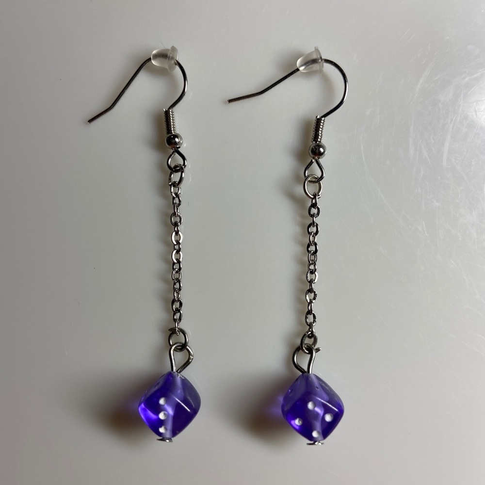 purple dangling dice earrings